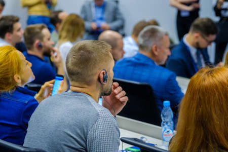 People attend business conference in the congress hall
