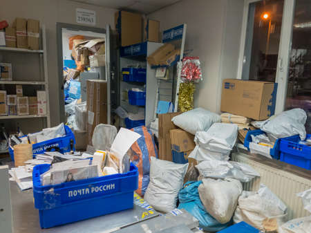 Moscow, Russia - December 19, 2017: Post office is overcrowded with parcels from online stores...