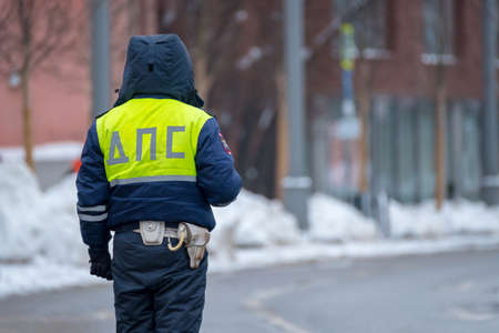 Traffic policeman on duty in winterの写真素材