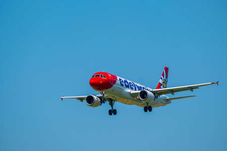 Zurich, Switzerland - July 19, 2018: Edelweiss airlines airplane preparing for landing at day time in international airportのeditorial素材