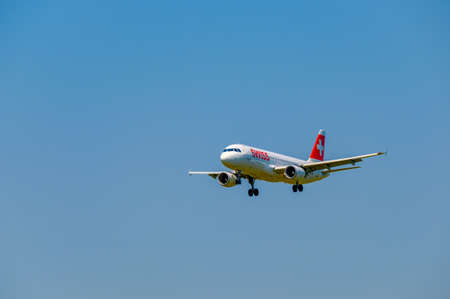 Zurich, Switzerland - July 19, 2018: Swiss airlines airplane preparing for landing at day time in international airportのeditorial素材