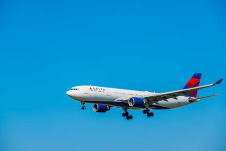 Zurich, Switzerland - July 19, 2018: Delta airlines airplane preparing for landing at day time in Zurich international airportのeditorial素材