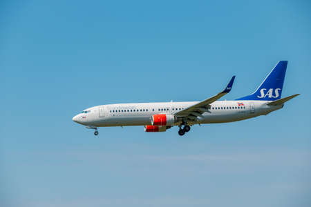 Zurich, Switzerland - July 19, 2018: Scandinavian SAS airlines airplane preparing for landing at day...