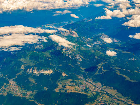 Top aerial view of villages in Switzerland mountains at summer time