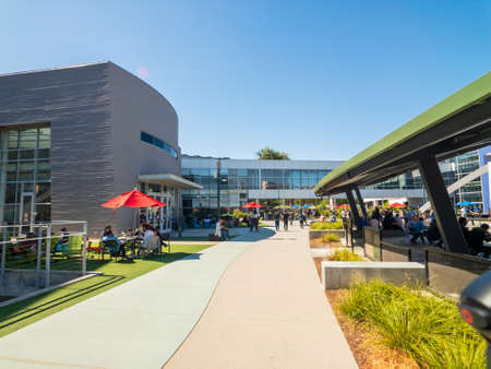 Mountain View, USA - September 25, 2018: Employees walking outdoors at Googleplex headquarters main officeのeditorial素材