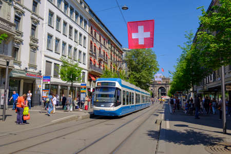 Zurich, Switzerland - May 3, 2018: People and city transport at Bahnhofstrasse at the morning timeのeditorial素材