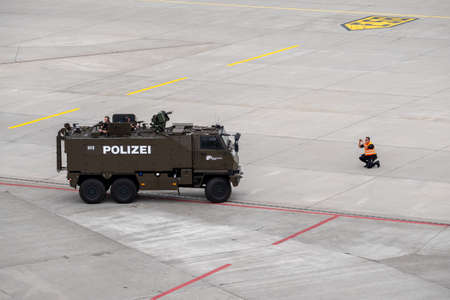 Zurich, Switzerland - July 19, 2018: Police on an armored car guarding a private jet