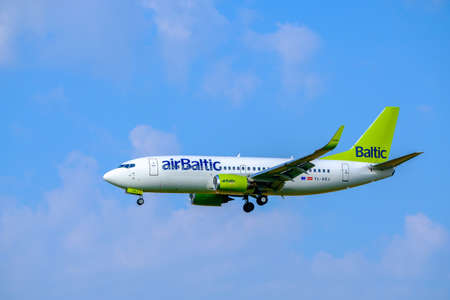 Zurich, Switzerland - July 19, 2018: Airbaltic airlines company airplane landing at airport