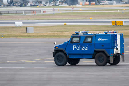 Zurich, Switzerland - July 19, 2018: Police on an armored car guarding a private jet