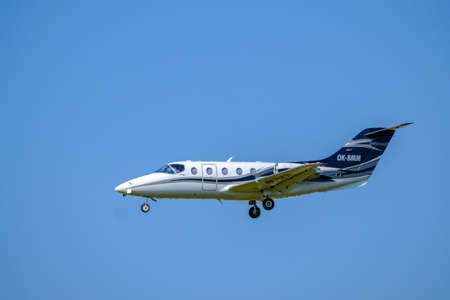 Zurich, Switzerland - July 19, 2018: Small private jet airplane preparing for landing at day time in...