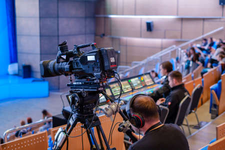 Audience at the conference, focus to the camera at foreground