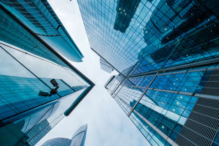 Skyscrapers in downtown area, bottom view, blue tones