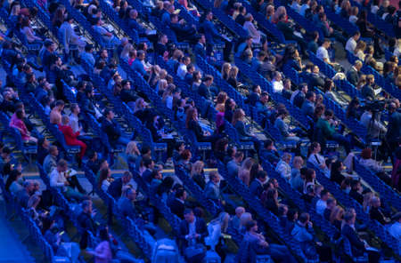 Saint Petersburg, Russia - October 4, 2019: Business conference attendees sit and listen to lecturer at large satdiumのeditorial素材