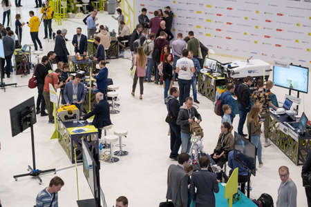 Skolkovo, Russia - October 21, 2019: Business forum visitors at exhibition space, top viewのeditorial素材