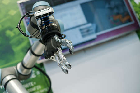 Robotic cyborg automated hand made with steel and black plastic as part of machine tool