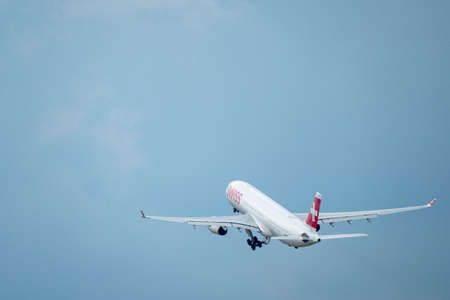 Zurich, Switzerland - July 19, 2018: Swiss airlines airplane preparing for landing at day time in international airportのeditorial素材