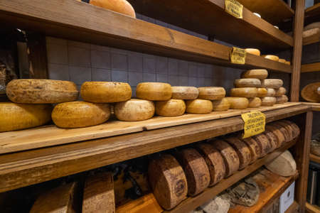 Val DOrcia, Italy - July 18, 2019: Large selection of cheese in local food shopのeditorial素材