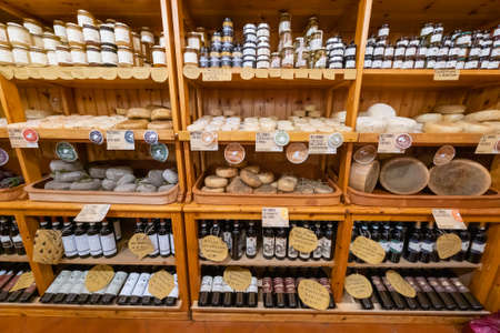Val DOrcia, Italy - July 18, 2019: Large selection of locally made food in Tuscany local food shop for touristsのeditorial素材