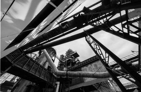 Old rusty construction of abandoned metallurgical plantの写真素材