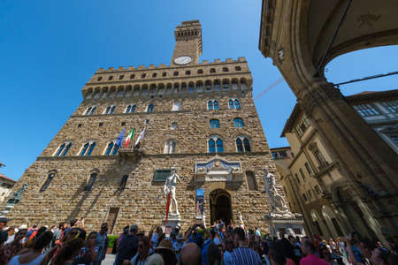 Florence, Italy - August 1, 2019: Tourists visiting the most famous attractions and monuments in old...