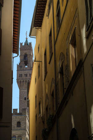 Florence, Italy - August 1, 2019: Tourists visiting the most famous attractions and monuments in old city, Palazzo Vecchio bell towerのeditorial素材