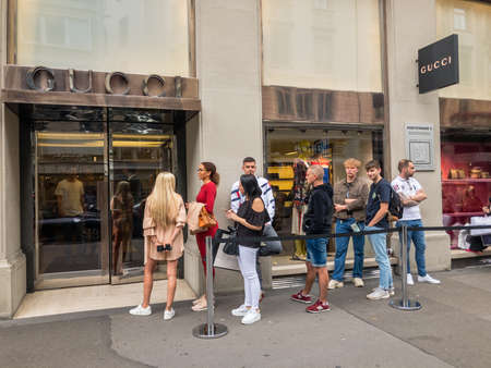 Zurich, Switzerland - August 13, 2019: Buyers waiting in line to visit Gucci store during sale timeのeditorial素材