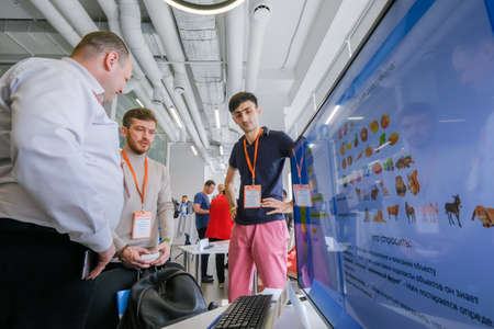 Moscow, Russia - April 19, 2018: Conference visitors converse at hallのeditorial素材