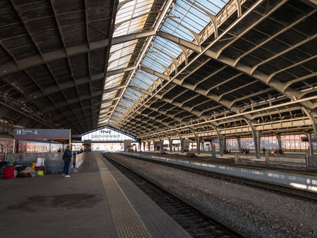 Kaliningrad, Russia - September 12, 2020: Paved platforms with passengers and empty rails located under roof of railroad stationのeditorial素材
