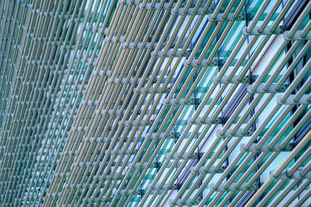 Textured background of metal bars on buildingの写真素材