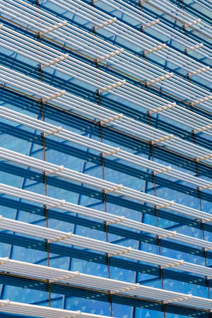 Textured background of metal bars on buildingの写真素材