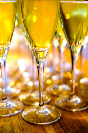 Glasses of champagne on table