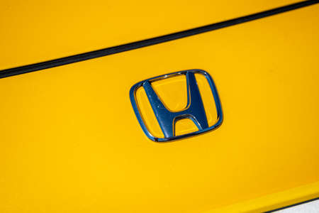 Shiny badge on yellow car