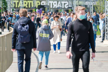 Crowd walking on square during business forumのeditorial素材