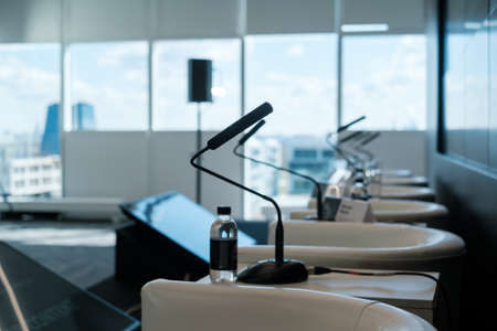 Table microphones at conference hallの写真素材