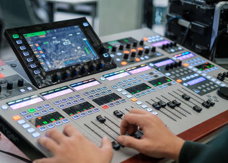 Man using sound recording equipment in studio