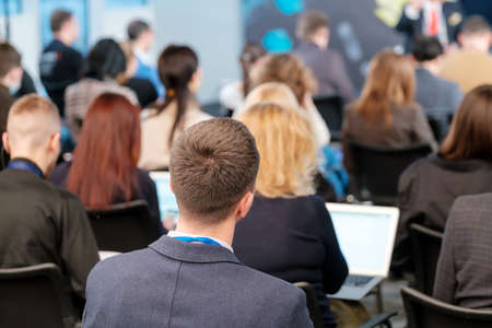 Businessman in conference hall with colleaguesの写真素材