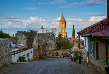 Street of old town with church