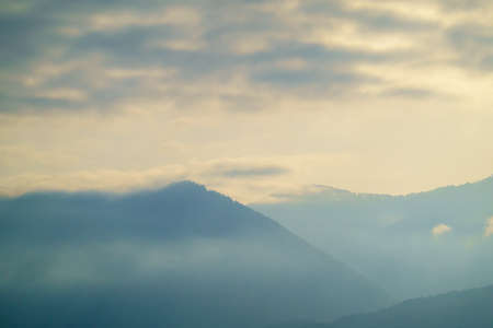 Cloudy sky over mountain in morning