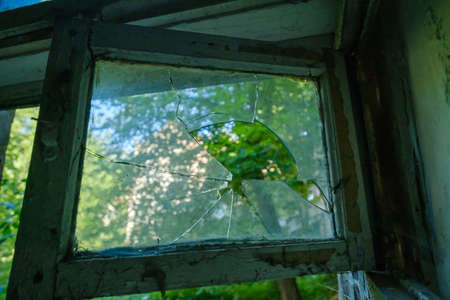 Broken window with wooden frameの写真素材