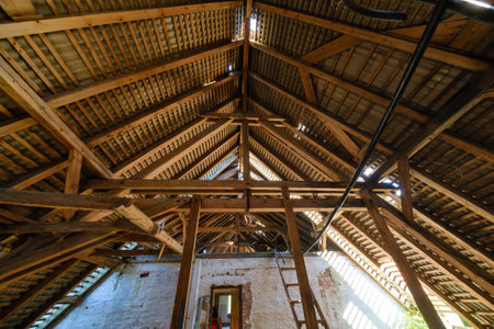Wooden roof of rural house in sunlight
