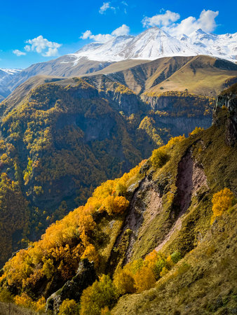 Mountain slopes and peaks in daytimeの写真素材