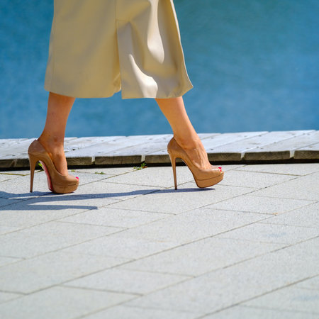 Crop woman walking on pathの写真素材