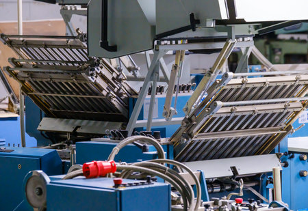 Industrial folding machine in typography workshop