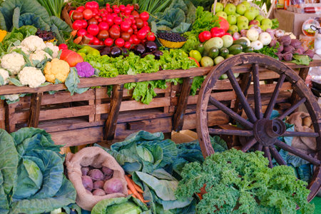 Wooden cart with various vegetablesの写真素材