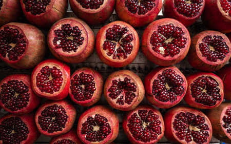 Ripe pomegranates on market stallの写真素材