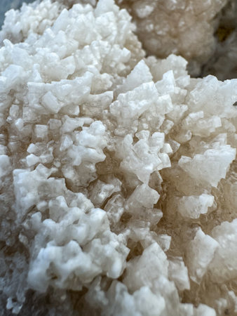 Detailed view of natural rock salt crystals showcasing their unique formations and textures.の写真素材