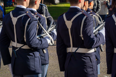 Italian soldiers in formal uniforms holding rifles during a public parade in daylight