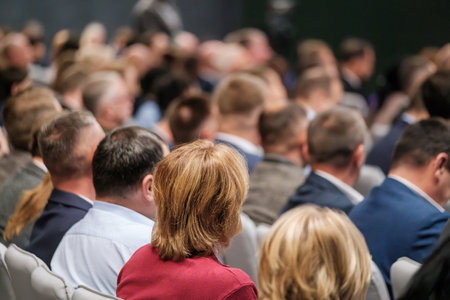Crowded convention hall full of attendees engaged in a professional event or meeting