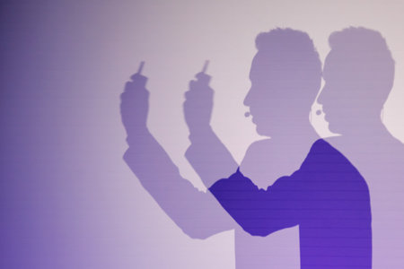 Creative shadow of speaker holding device and speaking into microphone under vivid illumination.