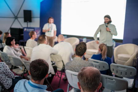 Group of participants attending a workshop or presentation. Educational or professional environment.